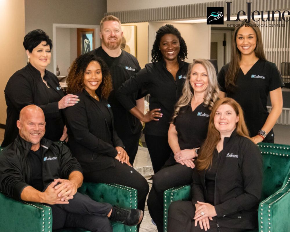 Group photo of LeJeune Integrated Medical Center team members smiling in office setting
